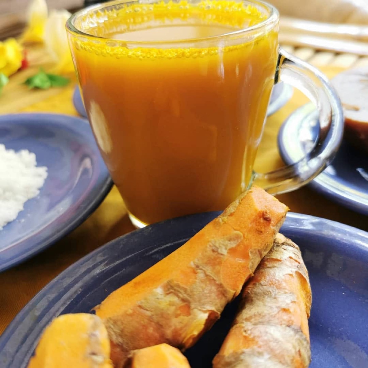 Fresh turmeric jamu herbal drink served at the studio